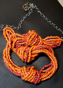 Купить украшение Бисерное колье-жгут "Оранжевые узелки"